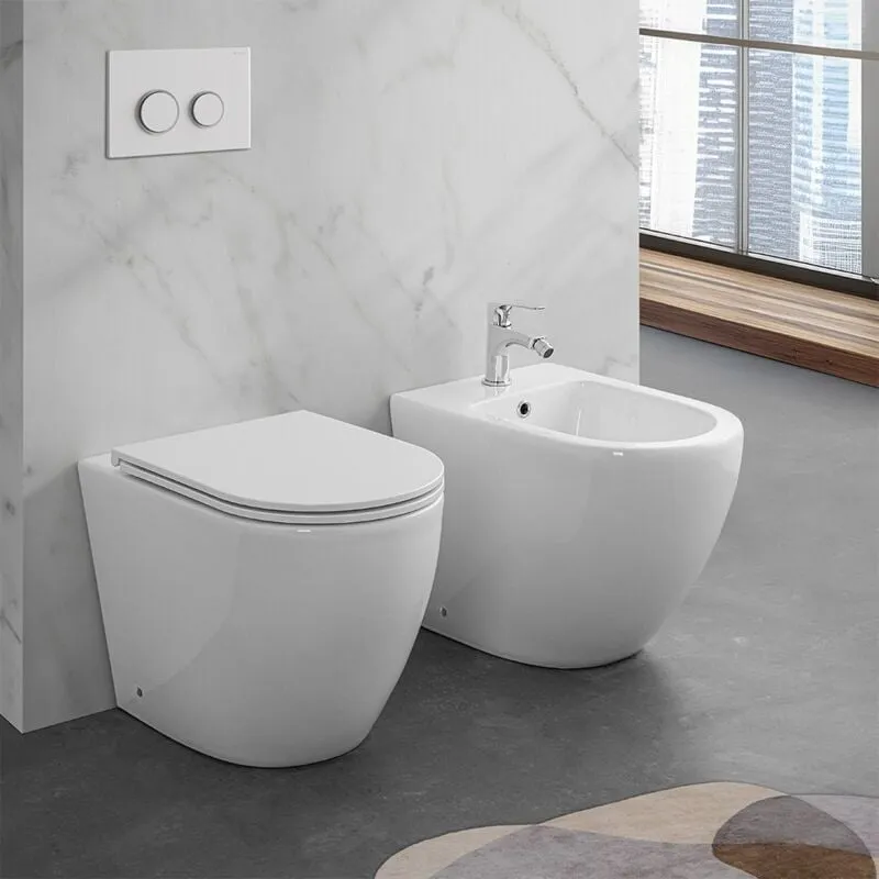 Wc e bidet filomuro per anziani con scarico traslato serie Comoda